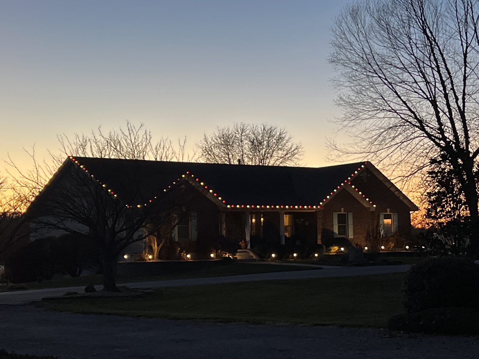 A finished Santa Squad Christmas light display at night