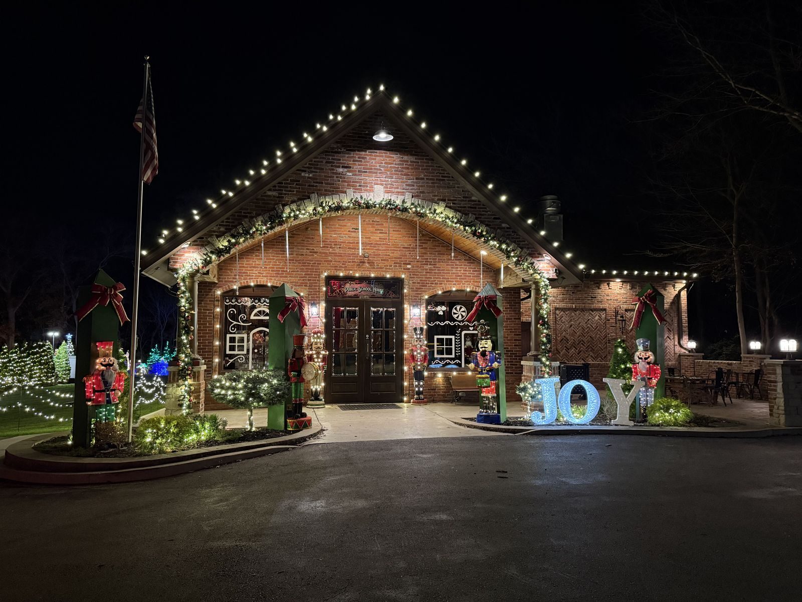 A festive Santa Squad Christmas light display at night